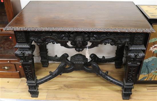 A 19th century carved oak centre table W.109cm